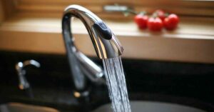How do you clean a Grohe Kitchen Faucet Spray Head?